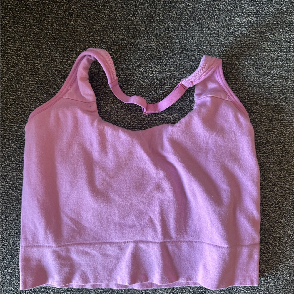Pink sports bra size small open back. Not sure the brand!